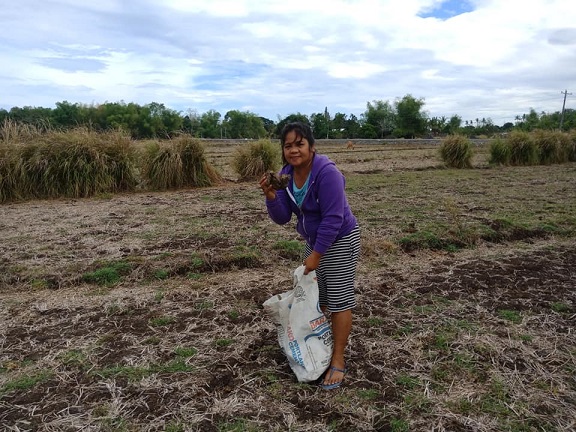 Leah collecting dung